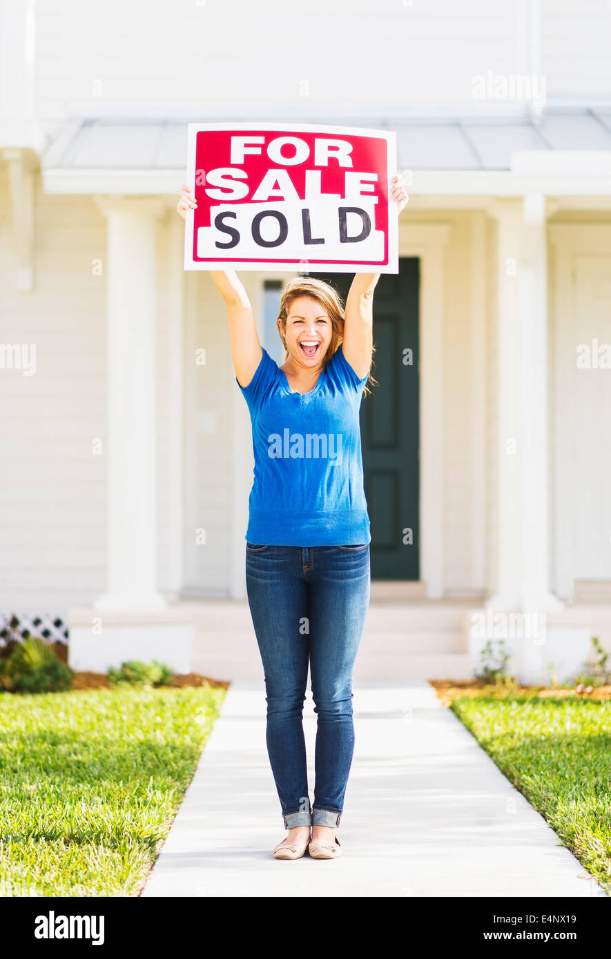 USA, Florida, Jupiter, Woman holding for sale sign Stock Photo - Alamy