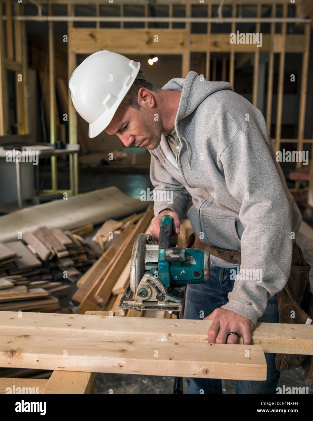 Lumber at work on new structure Stock Photo