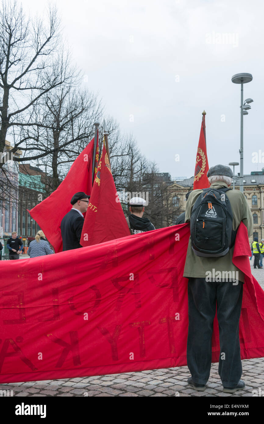 Red flags at May Day Celebration at Railway Square in Helsinki Stock