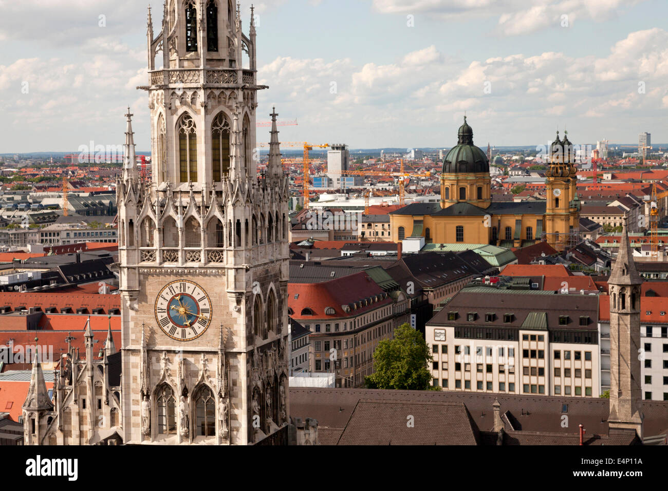 tower of the new townhall  on the central square Marienplatz and the  Theatine Church in Munich, Bavaria, Germany Stock Photo