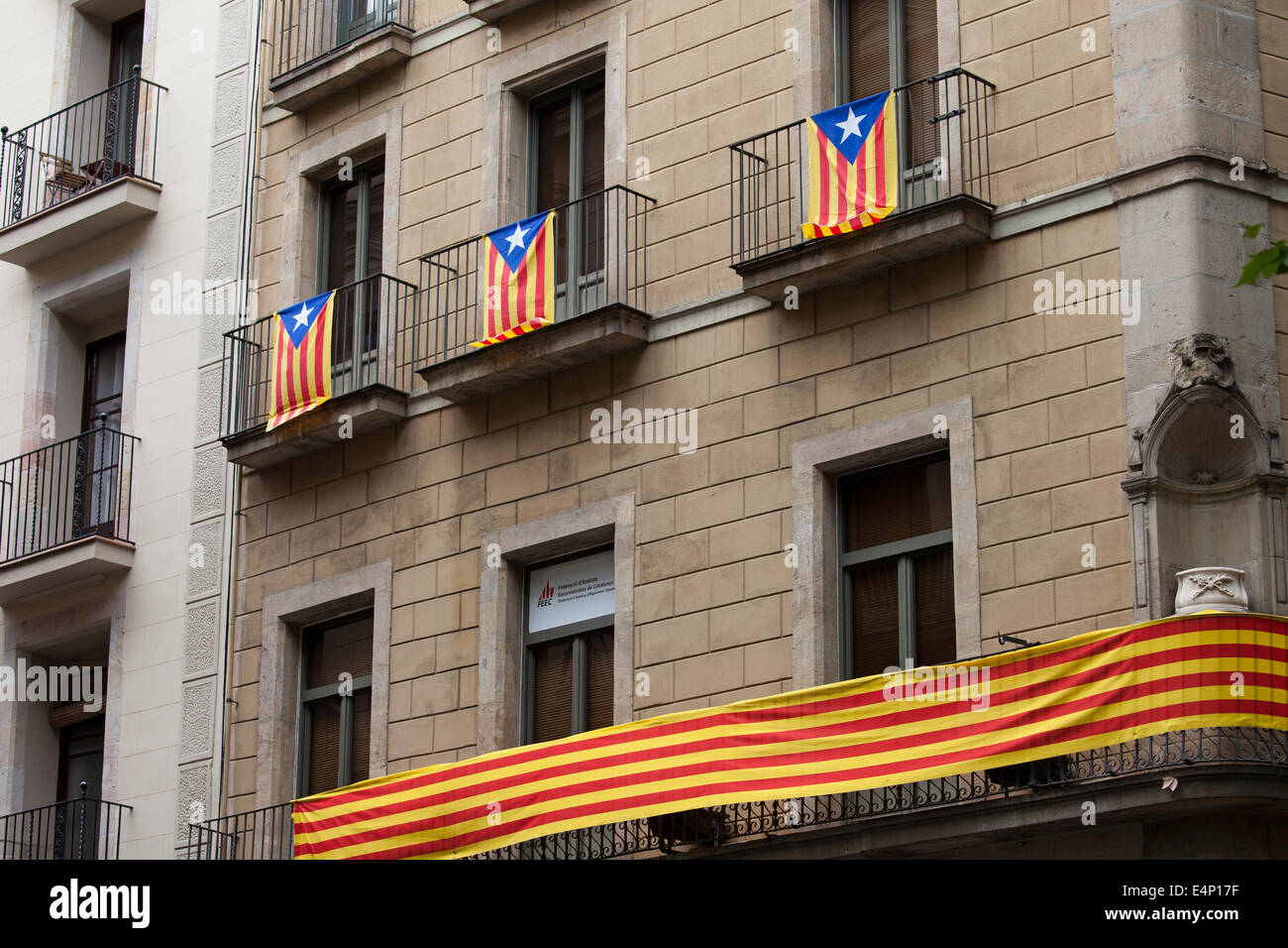 Flag of Catalonia called Estelada, Catalan flags on a building balconies in Barcelona, Catalonia, Spain. Stock Photo