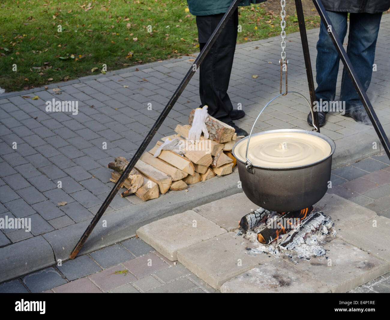 Cooking in a large pot, outside Stock Photo - Alamy