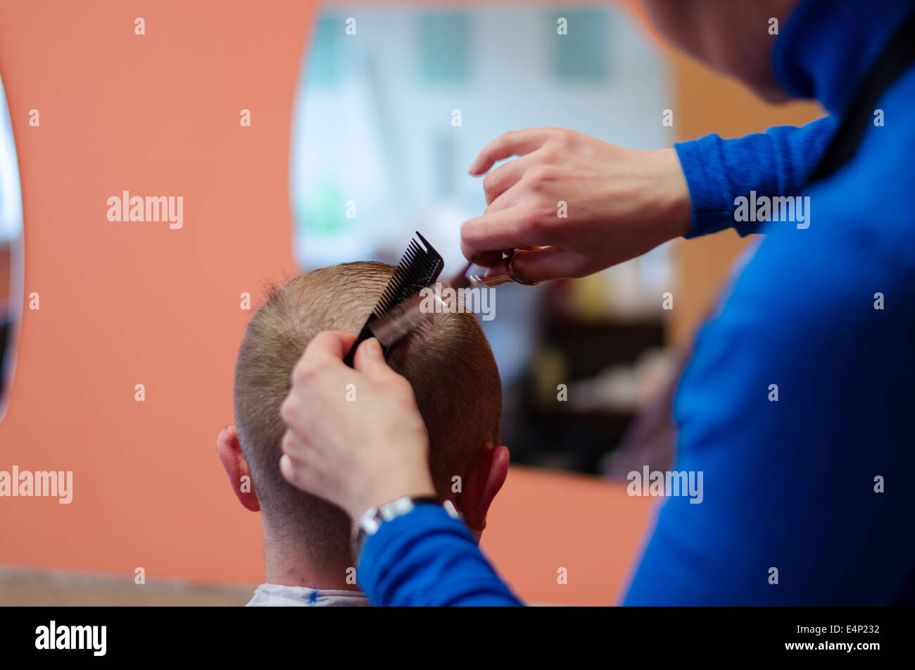 man haircut at the barber scissors at beauty salon Stock Photo