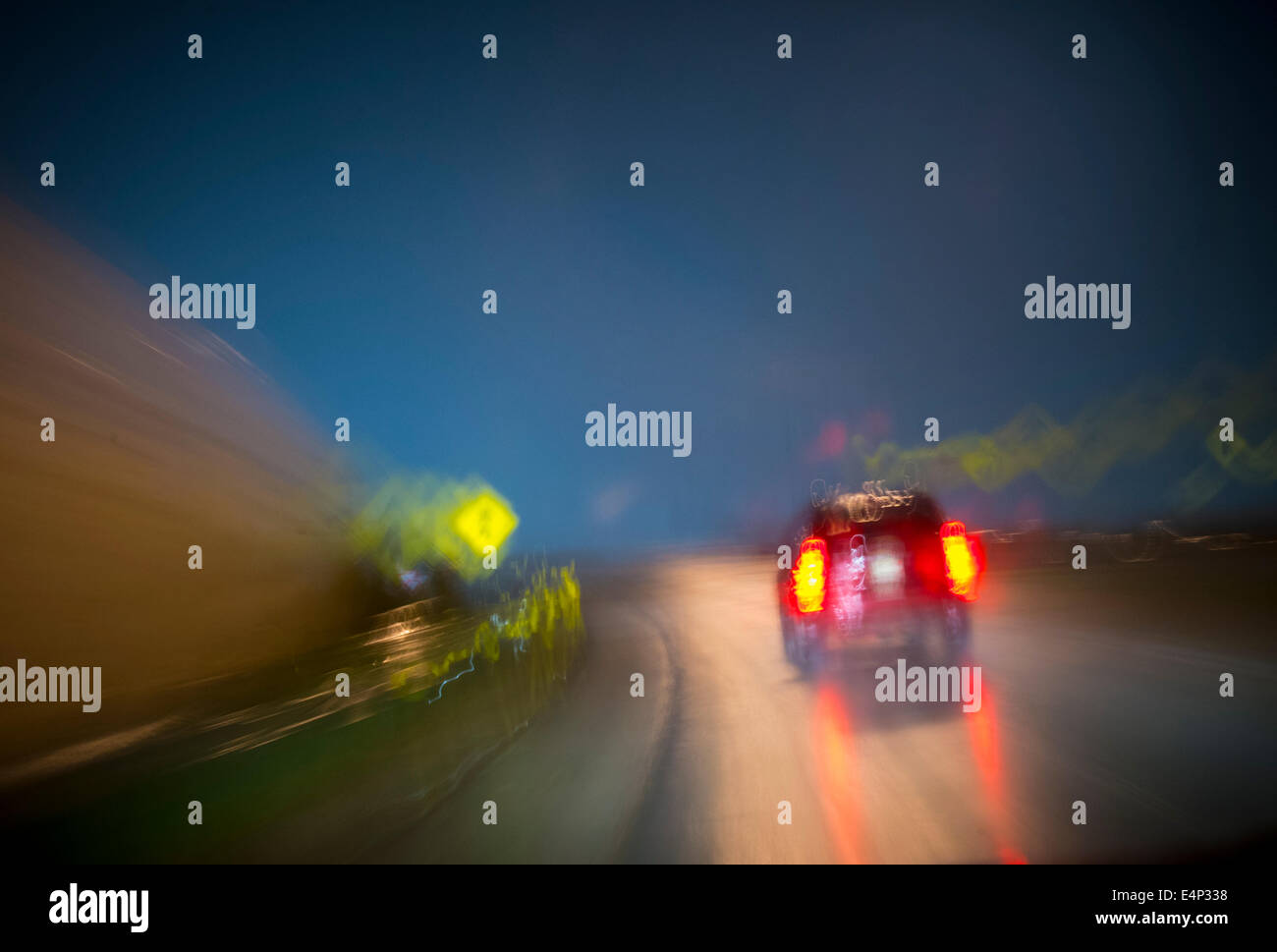 Car On Highway At Night During Rain Storm, USA Stock Photo