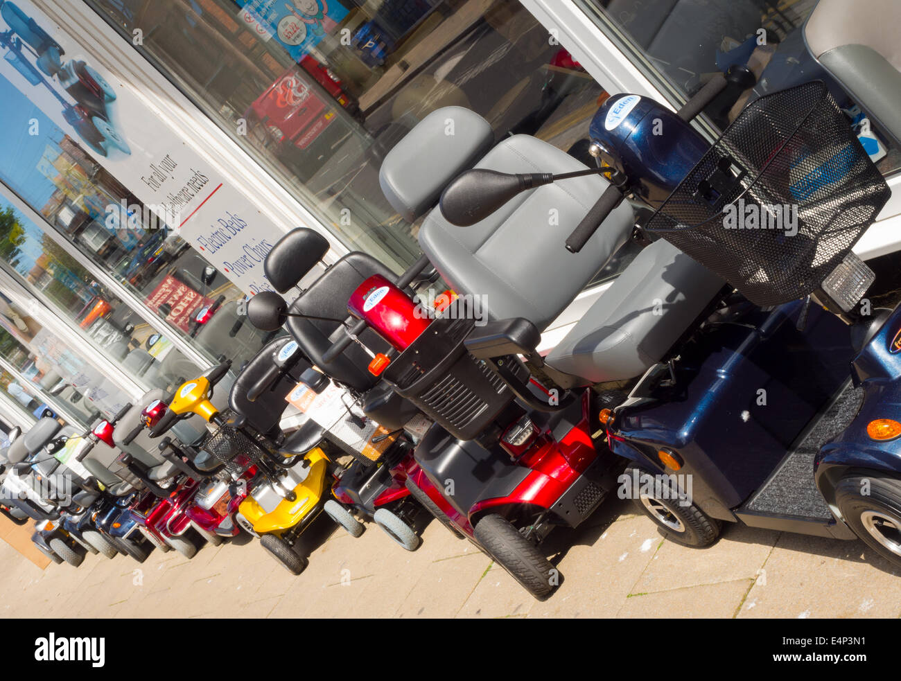 Mobility scooters for sale outside a shop in Bridlington on the Yorkshire coast Stock Photo Alamy
