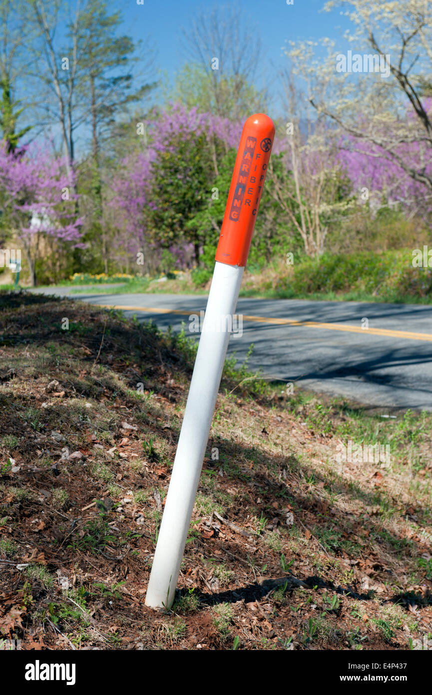 Warning post for underground fiber optic cables in Virginia, USA. Stock Photo