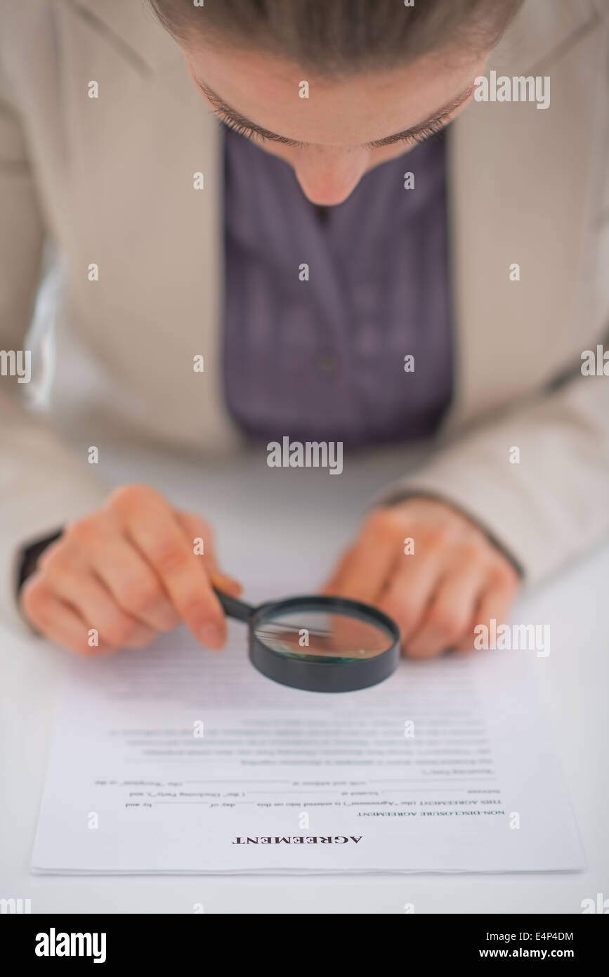 Woman magnifying glass contract hires stock photography and images Alamy