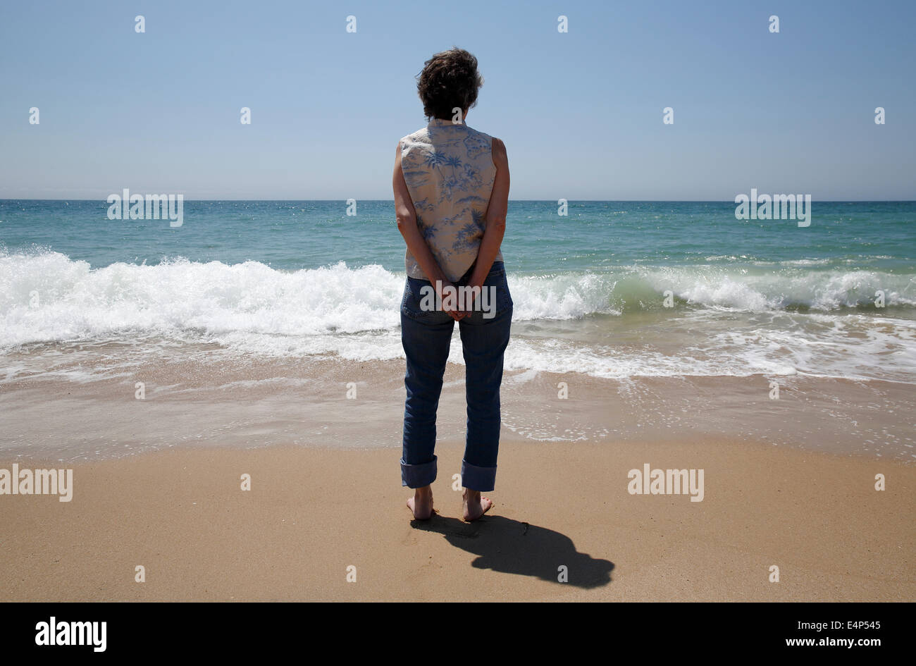 Woman standing on the beach, Montauk, New York, USA Stock Photo