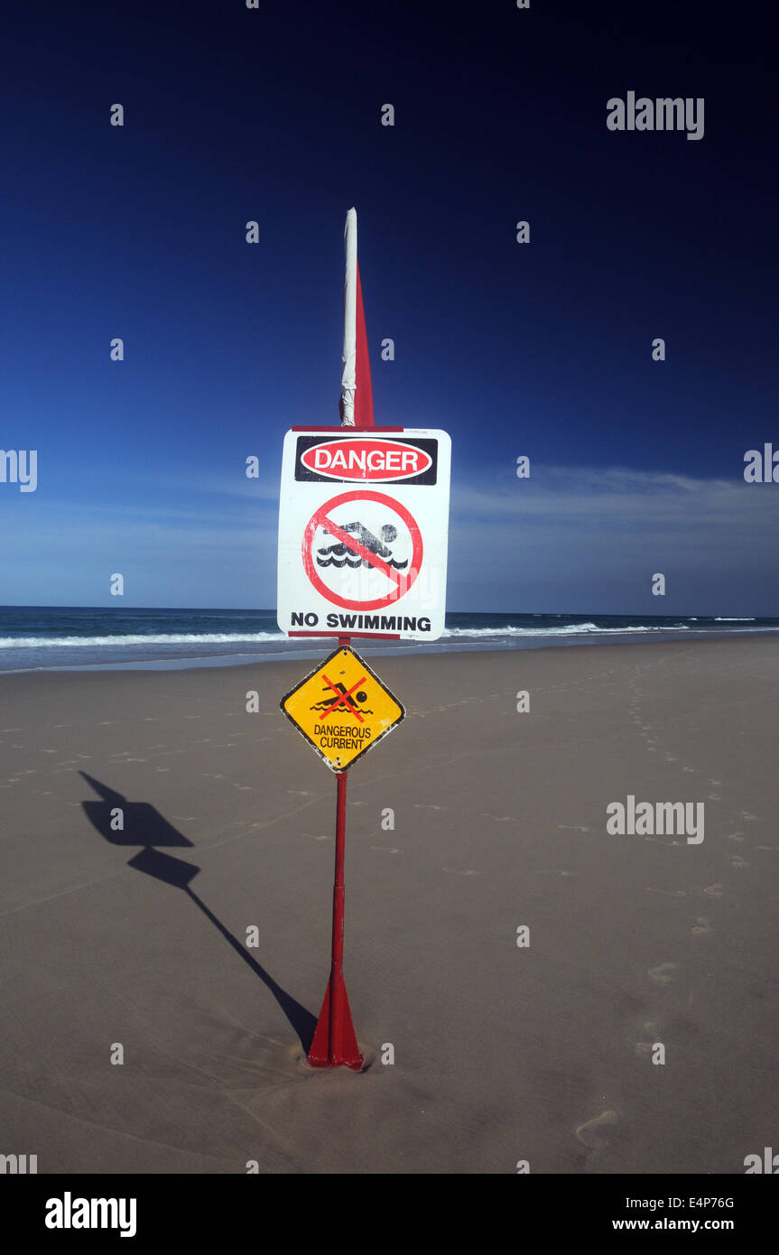 Dangerous currents - no swimming - sign on Main Beach, North Stradbroke Island, Queensland, Australia. No PR Stock Photo