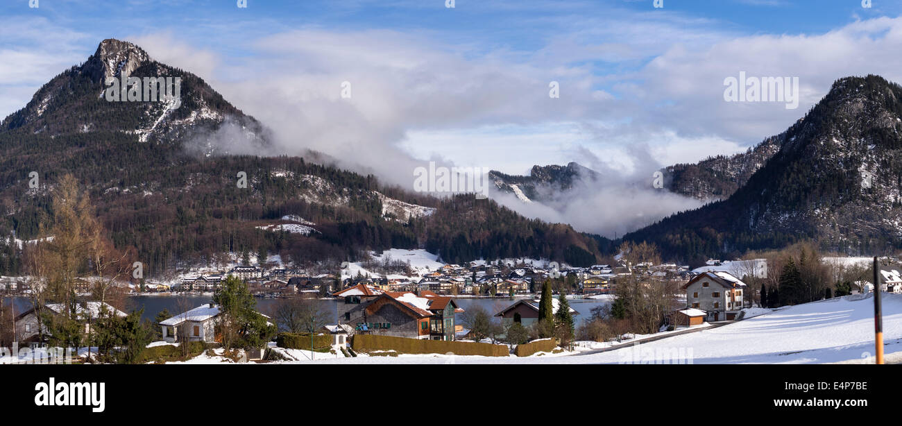 Austrian Mountain Village. Fuschi am See village is clustered around a mountain lake surrounded by high hills Stock Photo