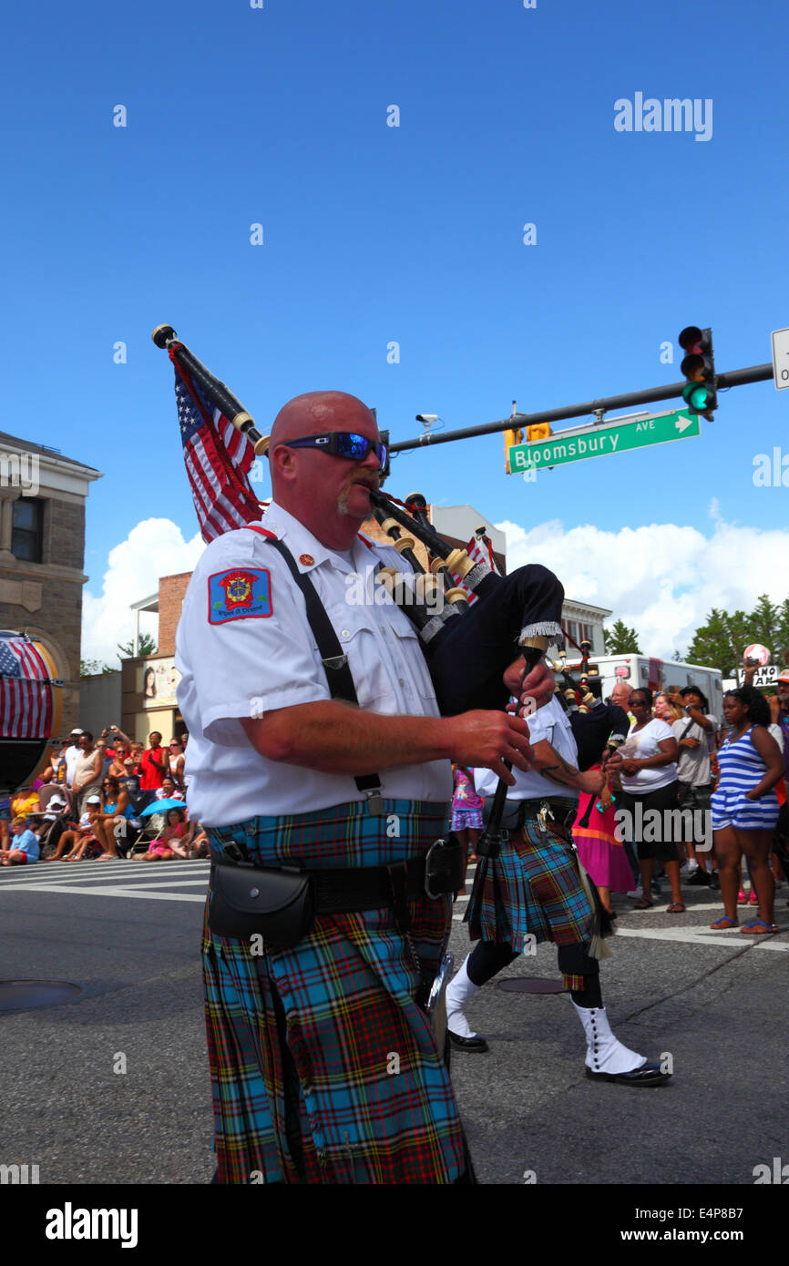 Bagpiper of Greater Baltimore Fire Brigade Pipes and Drums Highland Band parading during July 4th Independence Day parades, Catonsville, Maryland, USA Stock Photo