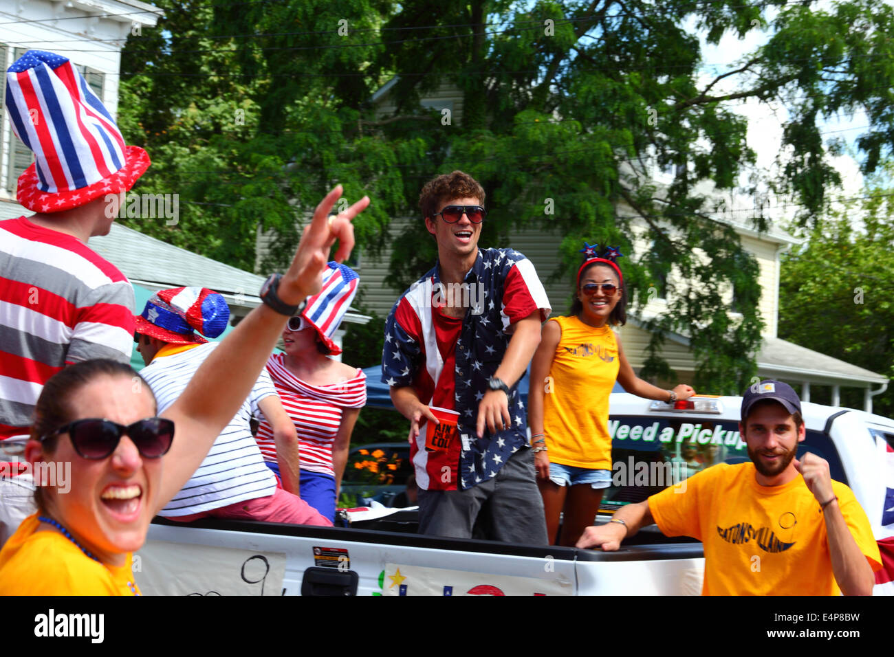 Young people in back of pick up truck celebrating 4th of July Independence Day parades, Catonsville, Maryland, USA Stock Photo