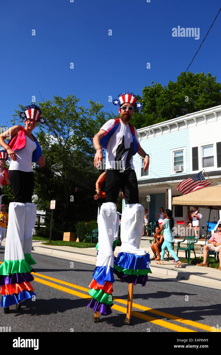Performers on stilts taking part in 4th of July Independence Day parades, Catonsville, Maryland, USA Stock Photo