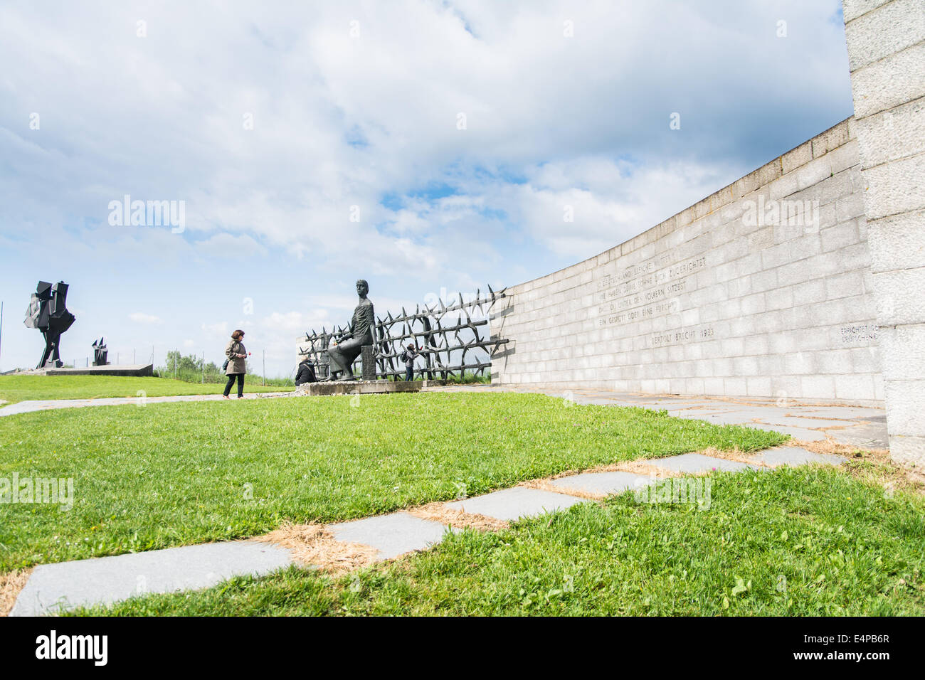 Mauthausen,Austria-May 10,2014:people admire one of the more monument before entering the camp during a cloudy day Stock Photo
