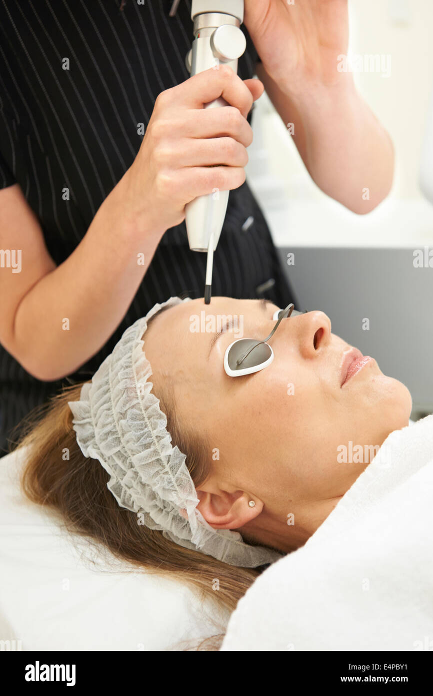 Woman Having Skin Rejuvenating Laser Treatment In Clinic Stock Photo