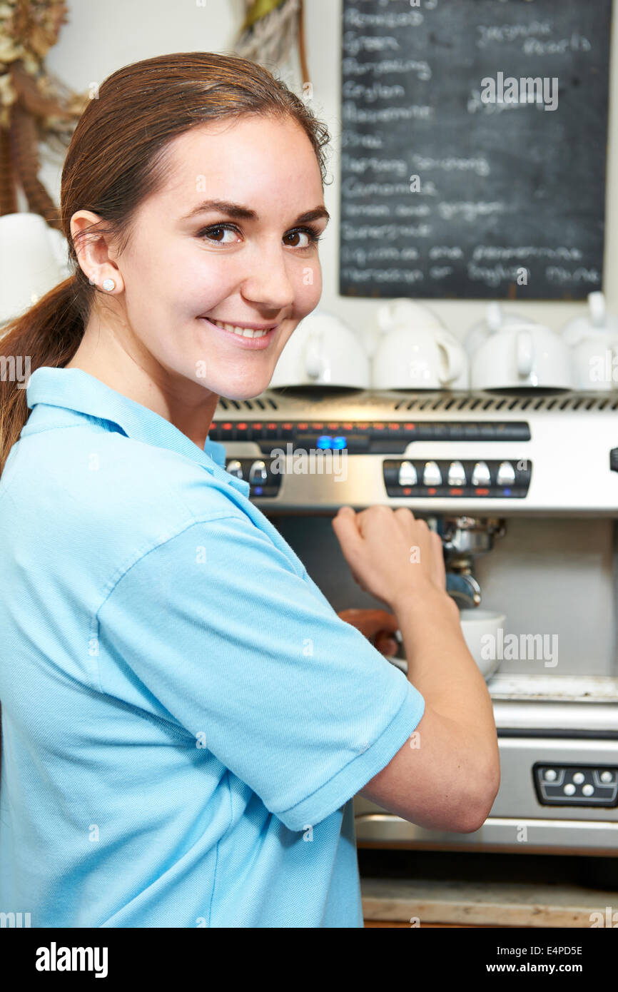 Woman In Cafe Making Cup Of Coffee Stock Photo Alamy