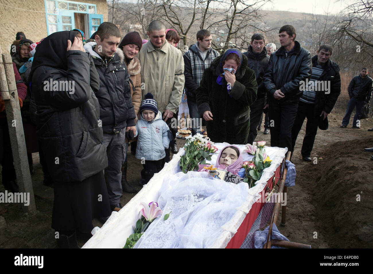 Tuberculosis in Moldova, burial of a patient, the family lives in poverty, the young mother leaves behind a one-year-old Stock Photo