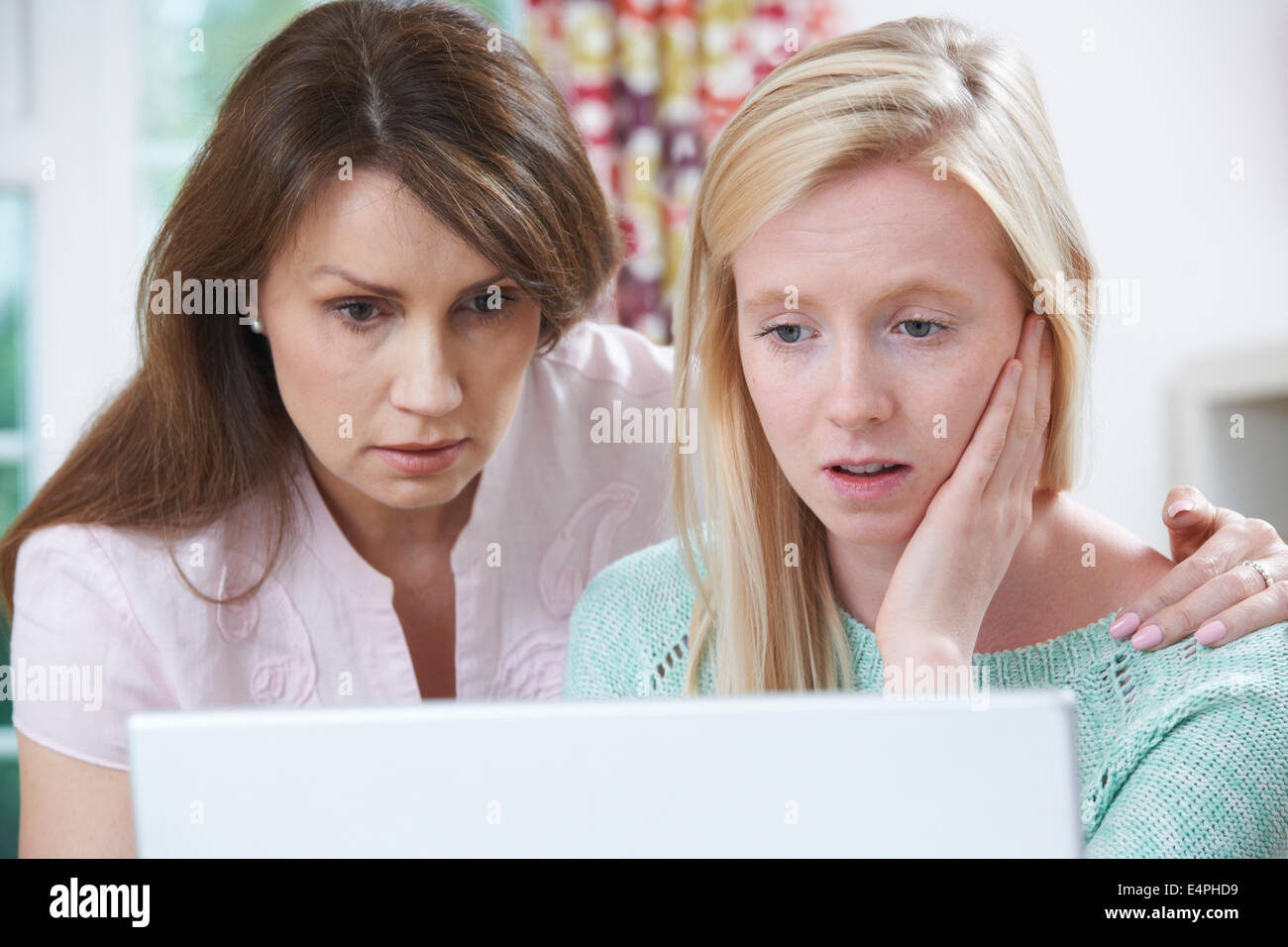 Mother Comforting Daughter Victimized By Online Bullying Stock Photo ...