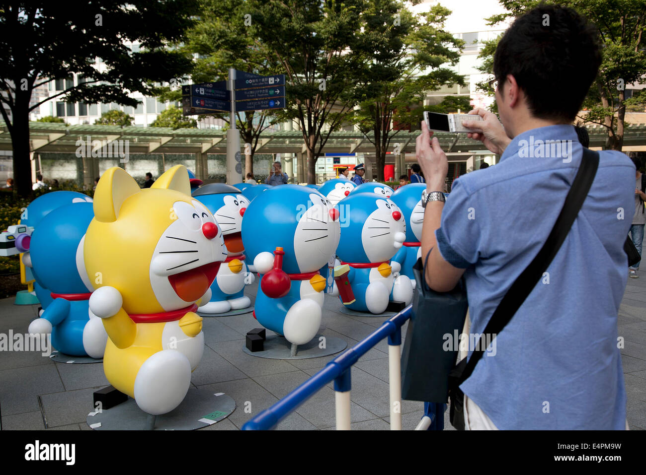 Tokyo Japan 16th July 14 People Take Pictures Of Doraemon Statues At Roppongi Hills On July 16 14 Sixty Six Different Statues Of Popular Japanese Cartoon Character Doraemon Are Lined Up In Front Tokyo Japan 16th July 14 People Take Pictures Of Doraemon Statues At Roppongi Hills On July 16 14 Sixty Six Different Statues Of Popular Japanese Cartoon Character Doraemon Are Lined Up In Front