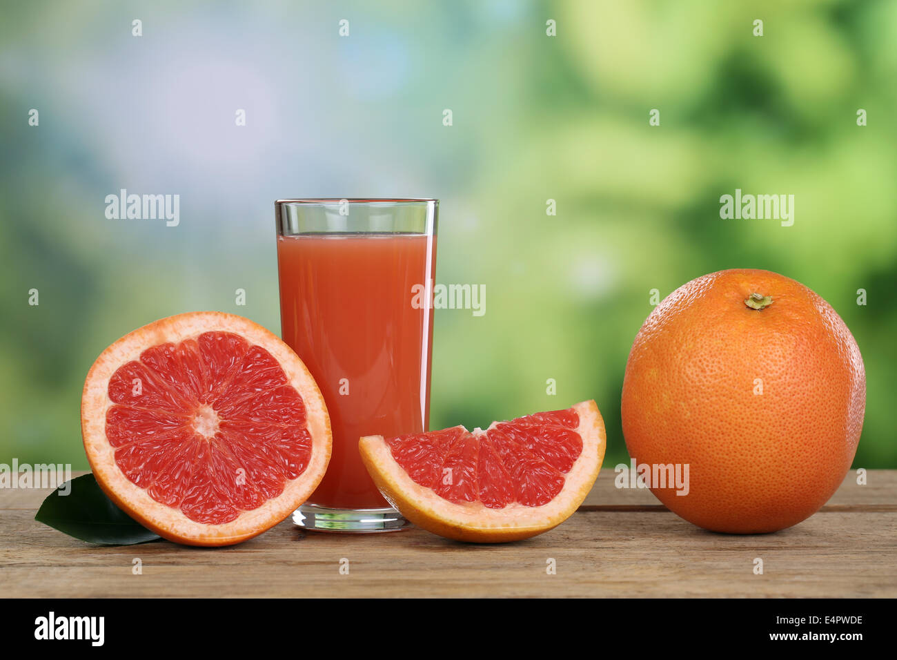 Grapefruit juice and fresh grapefruits fruits in summer Stock Photo