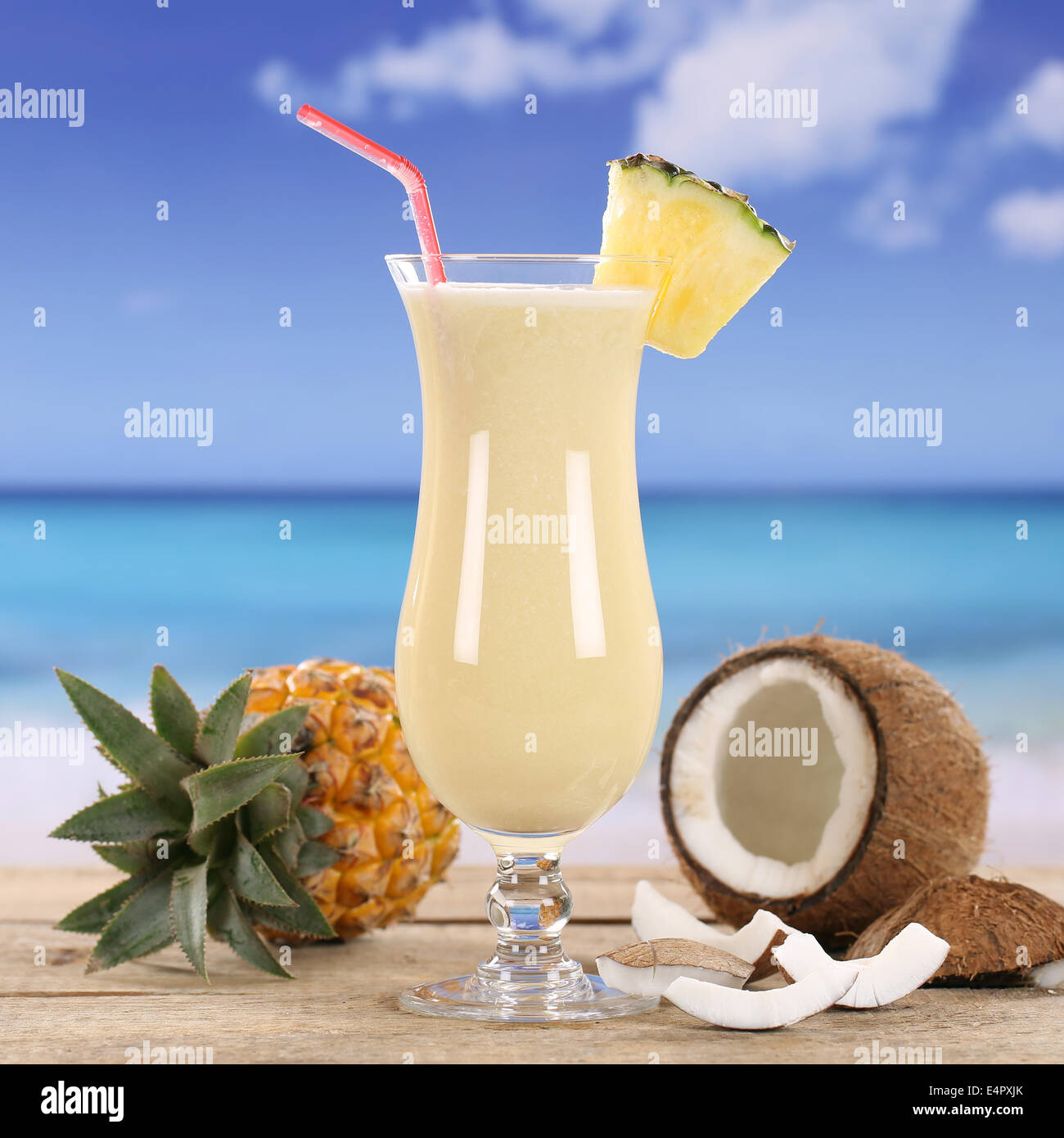 Pina Colada cocktail drink with fruits on the beach Stock Photo