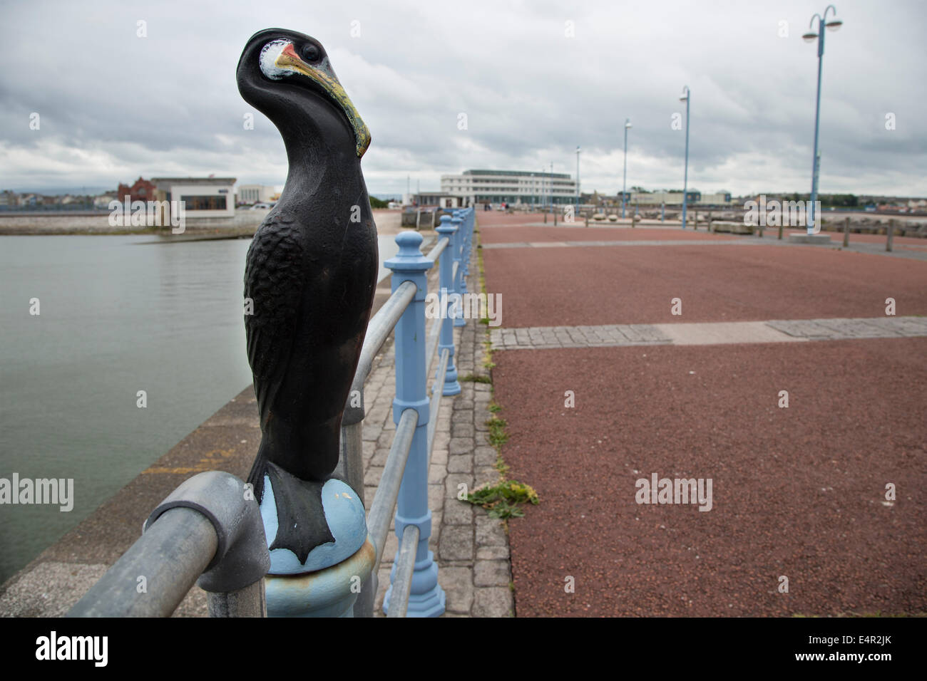 Bollard in the form of a cormorant, Morecambe Pier, Lancashire Stock Photo