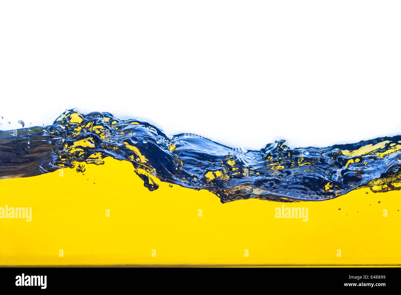 abstract image of a yellow liquid spilled. On a white background. Stock Photo