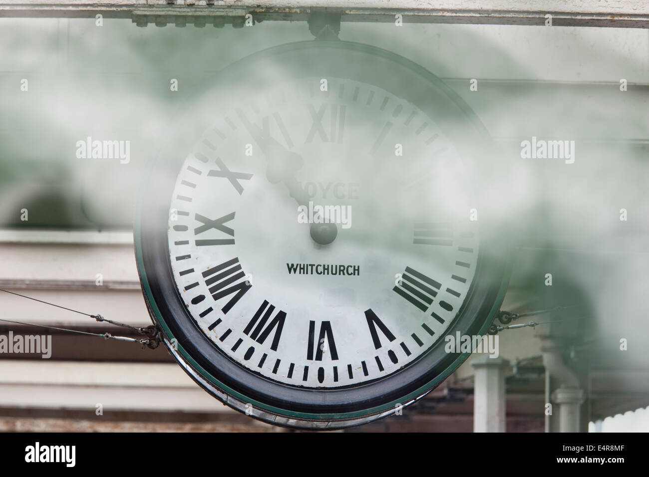 Carnforth station clock with steam. Stock Photo