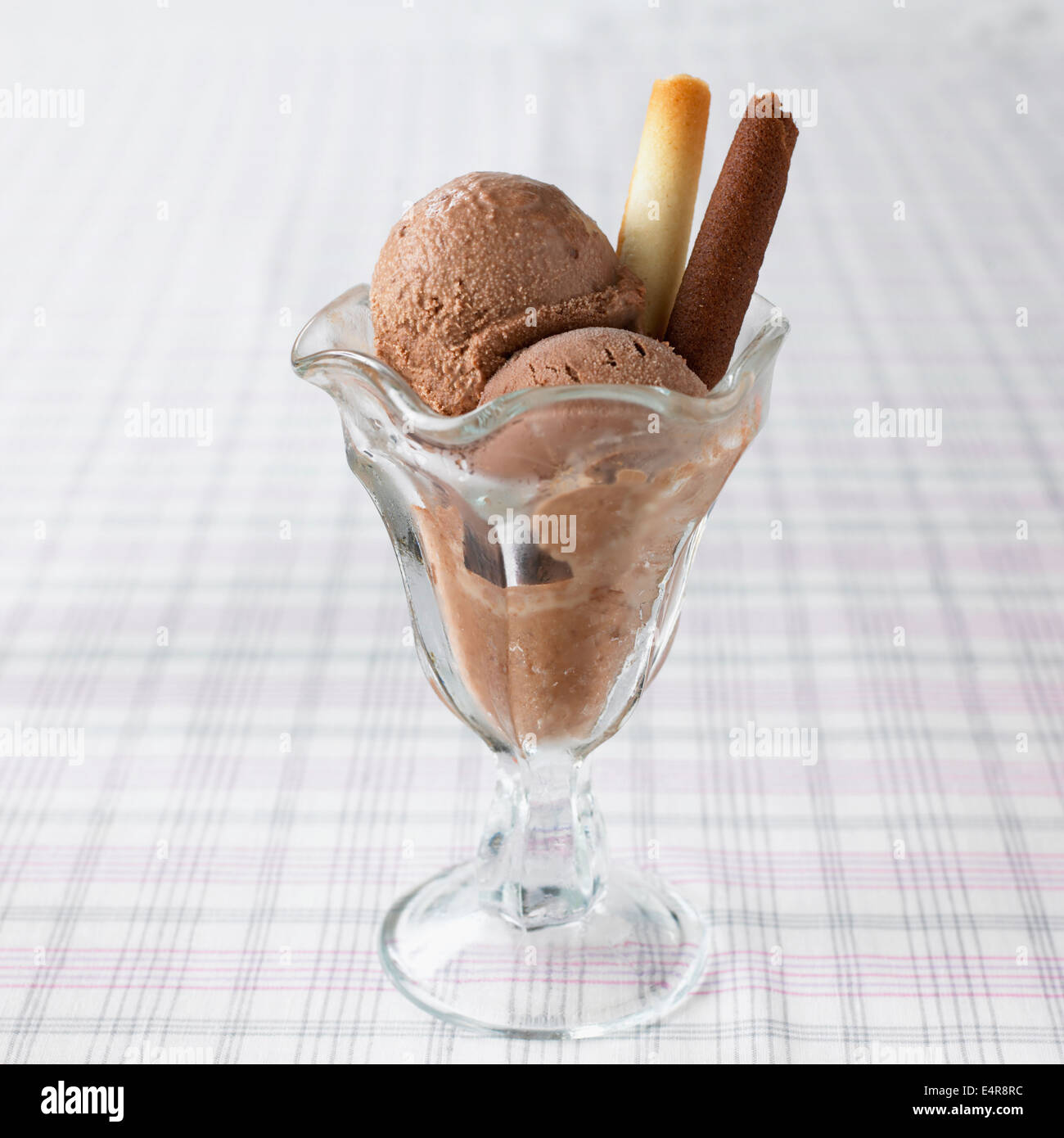 Chocolate ice cream with biscuit tubes Stock Photo