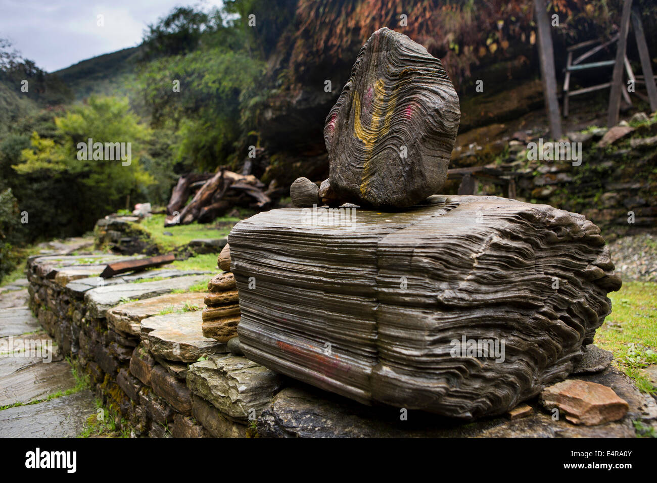 Nepal, Pokhara, Nangathanti, Hindu Shiva shrine made from layered rocks beside path to Ghorapani Stock Photo