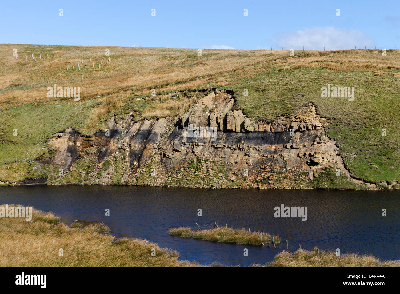 Sedimentay Rocks with Shale Band Next to a Water Supply North Pennines UK Stock Photo