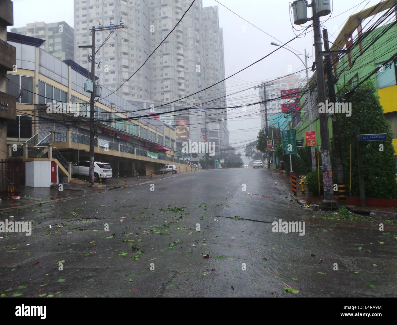 Manila, Philippines. 16th July, 2014. The Typhoon Glenda (Int'l name: Rammasun), the strongest storm to hit the country this year, killed at least 10 people, prompting the evacuation of more than 380,000 people and paralyzing financial markets, offices and schools. © Sherbien Dacalanio/Pacific Press/Alamy Live News Stock Photo