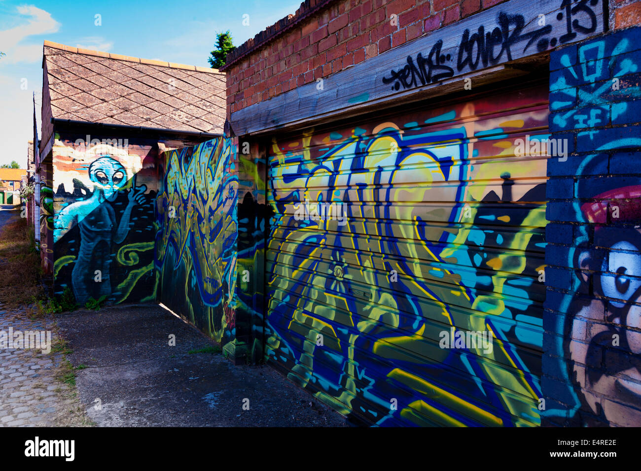 Graffiti on garage doors in a service road Abington Northampton. Stock Photo