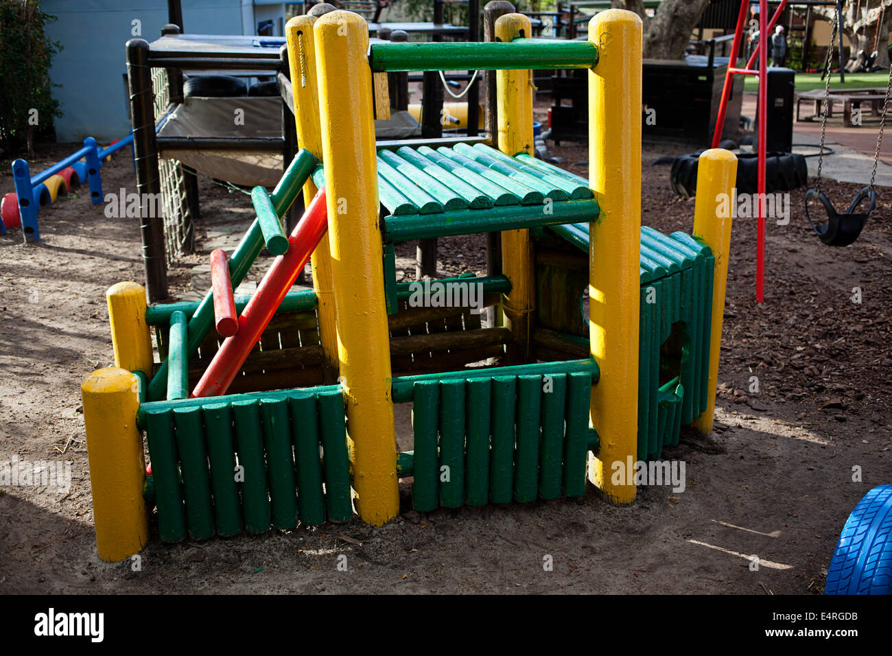 Painted wooden boat in a Children's school playground Stock Photo