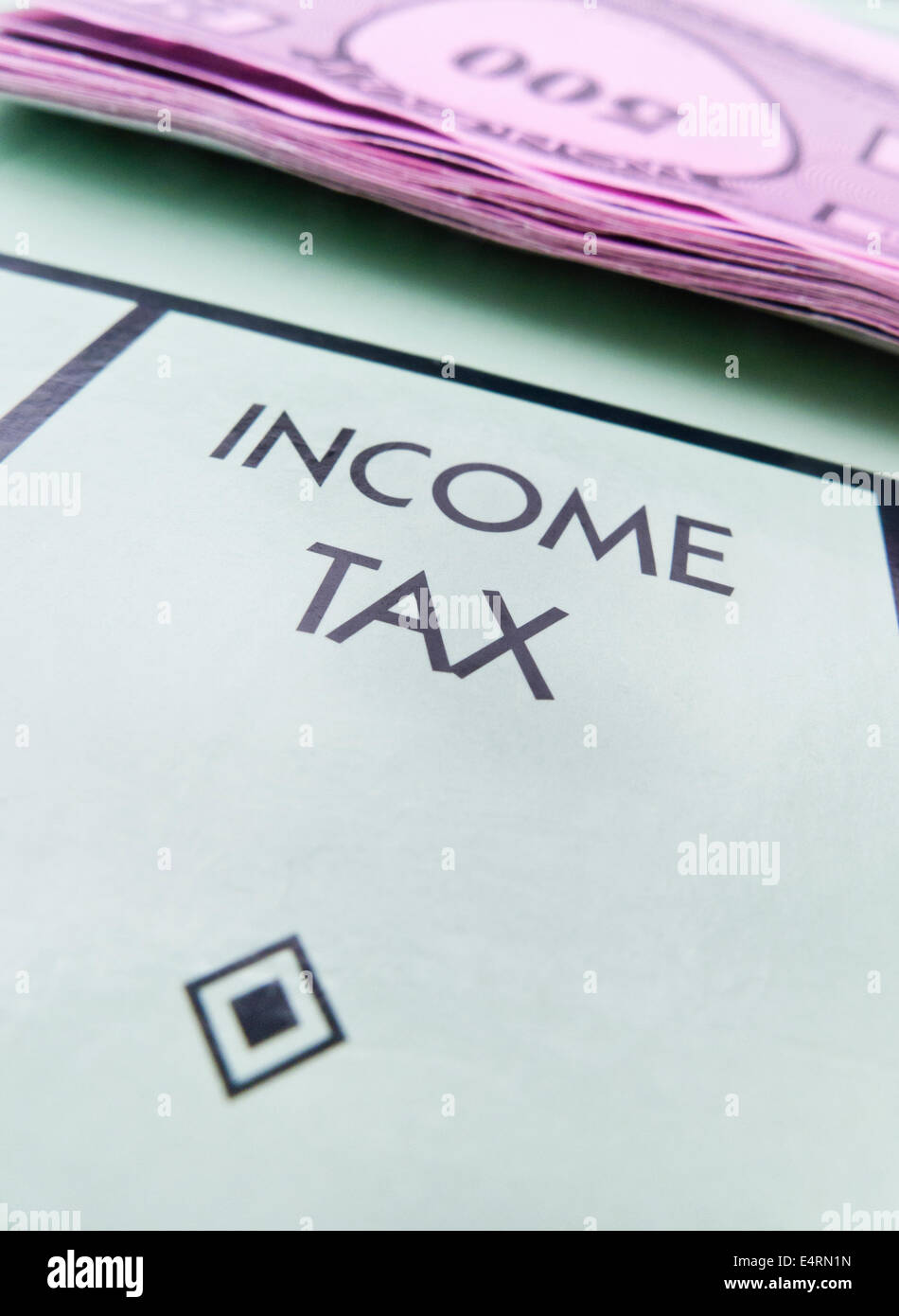 'INCOME TAX' square on a Monopoly board. Stock Photo