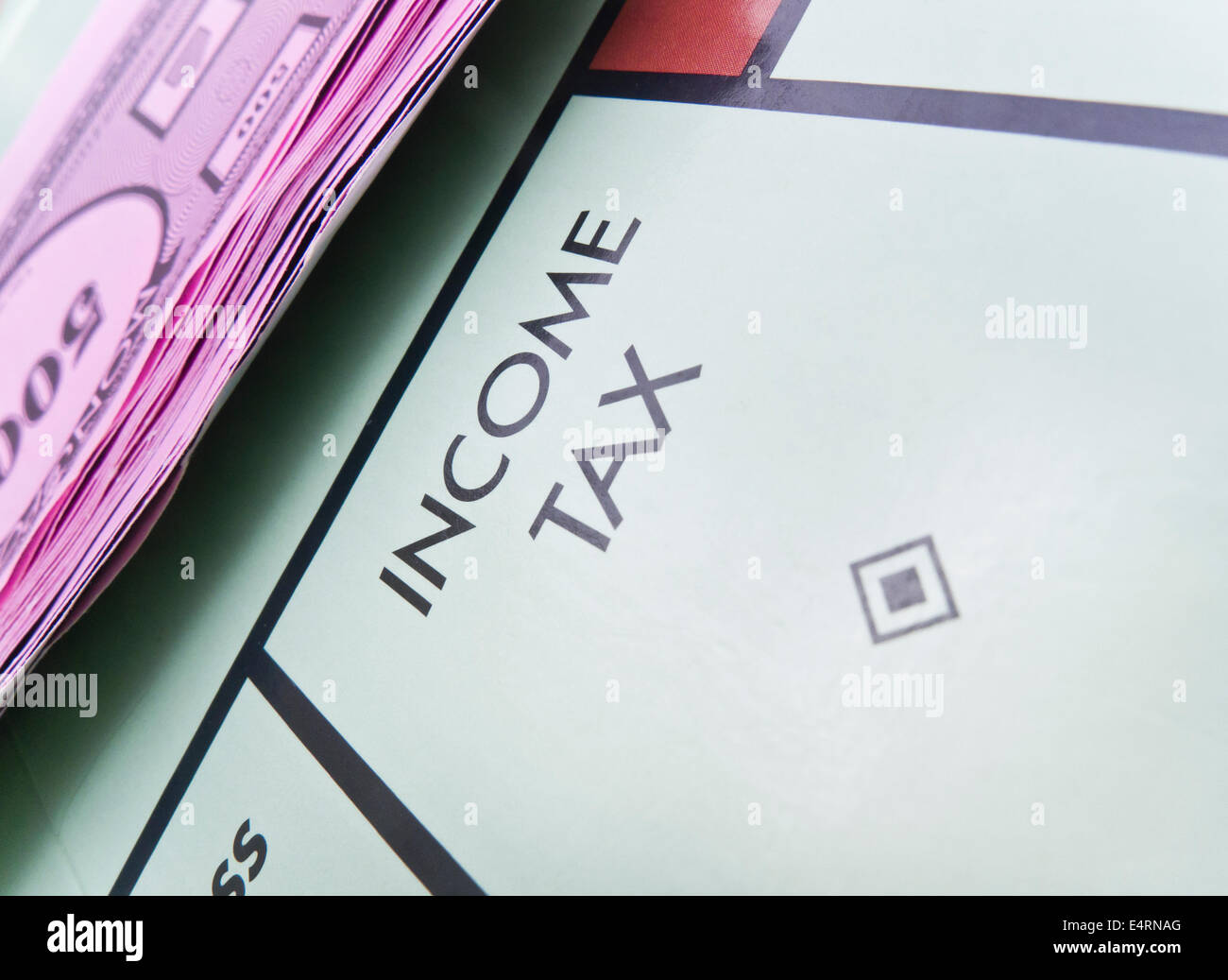 'INCOME TAX' square on a Monopoly board. Stock Photo