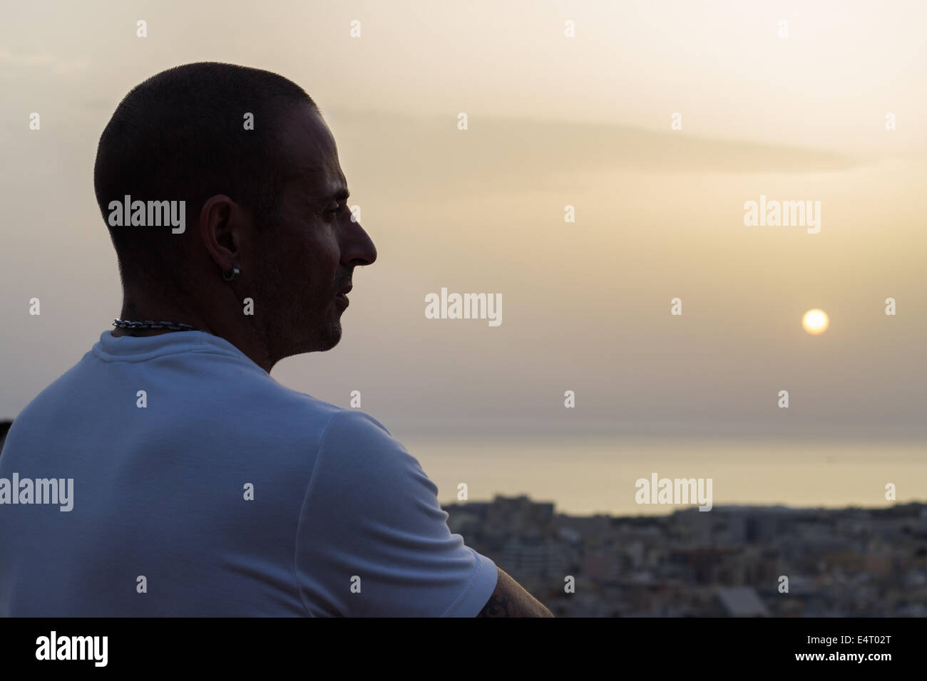 man silhouette sunset sun face portrait outdoors relaxing Stock Photo