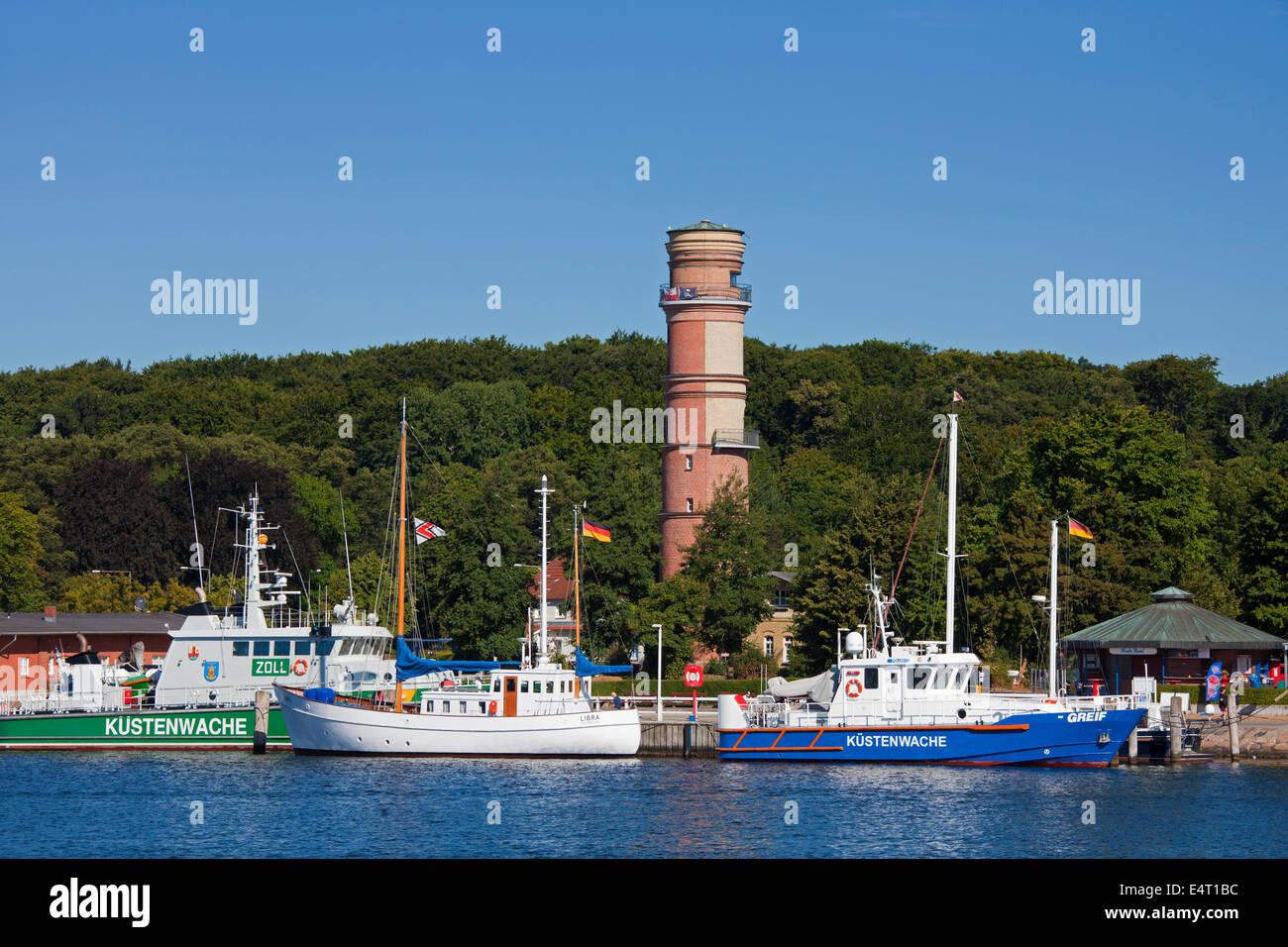 Coastguard Patrol Boats And The Old Lighthouse In The Port Of Coastguard Patrol Boats And The Old Lighthouse In The Port Of
