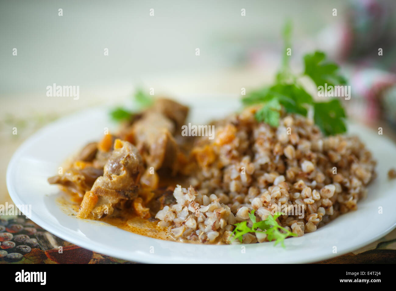 buckwheat cooked with stewed chicken gizzards in gravy Stock Photo Alamy