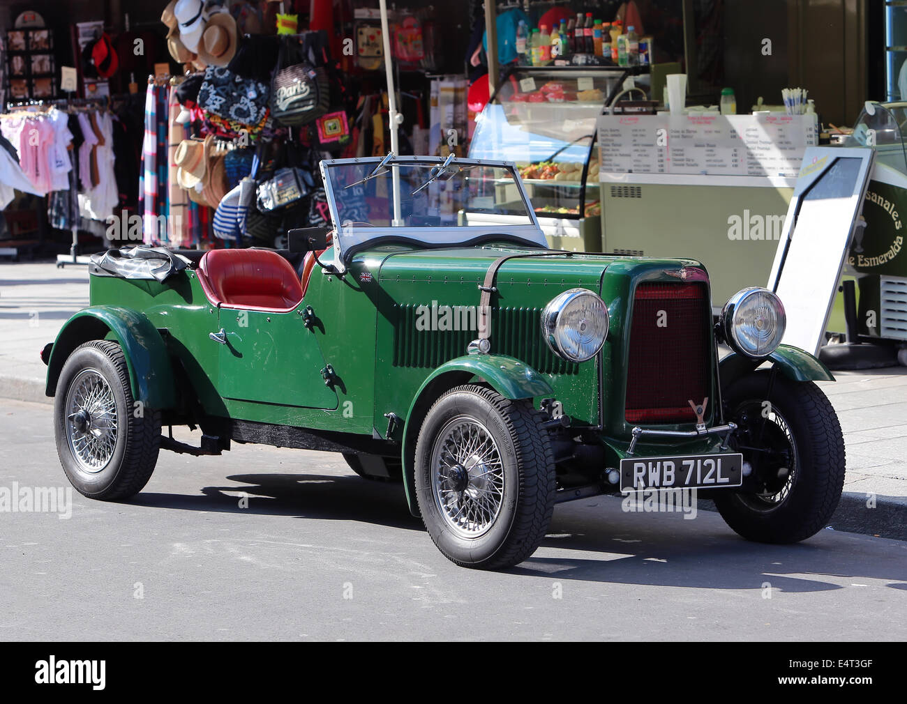 Green rarity english vintage car on Paris street Stock Photo