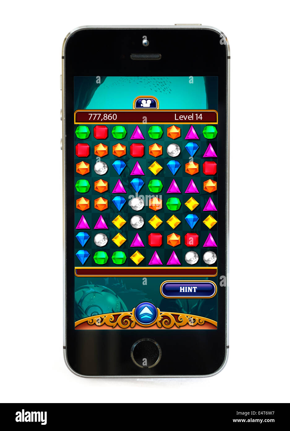 Playing the popular free game Bejeweled on an Apple iPhone 5S Stock Photo