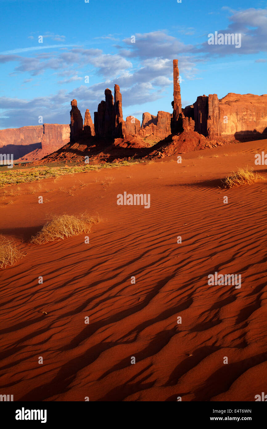 Yei Bi Chei and Totem Pole rock columns, and sand dune, Monument Valley, Navajo Nation, Arizona , near Utah border, USA Stock Photo