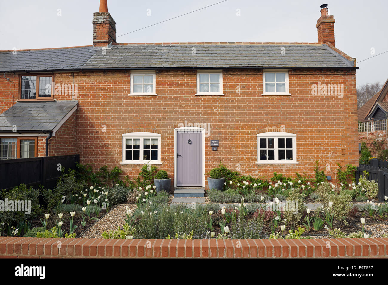Traditional red-brick semi-detached cottage, Bawdsey, Suffolk, UK. Stock Photo