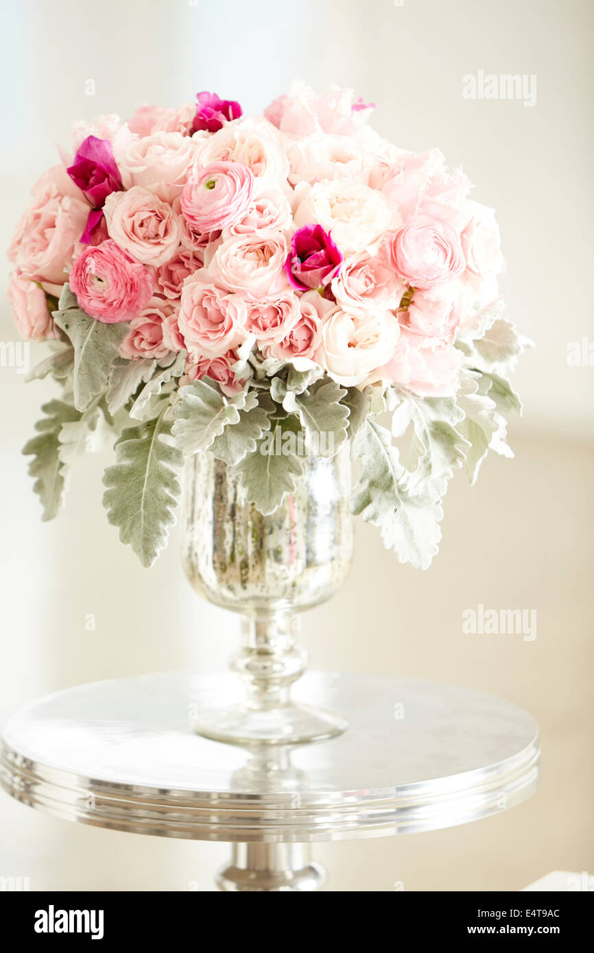 Silver And Pink Roses Bouquet of pink roses in silver vase on silver table, studio shot Stock ...