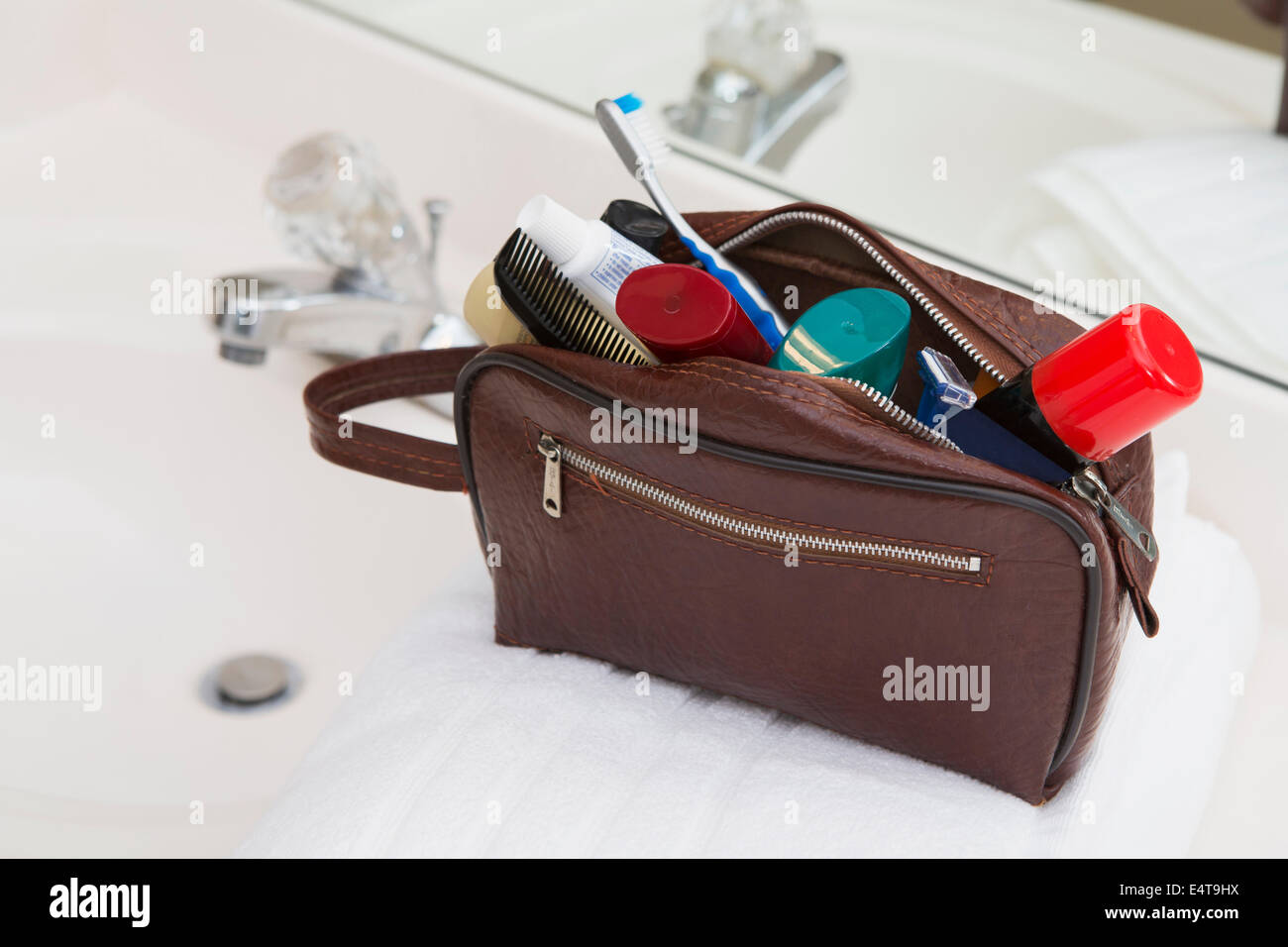Men's Toiletry Travel Bag on Bathroom Counter filled with Personal