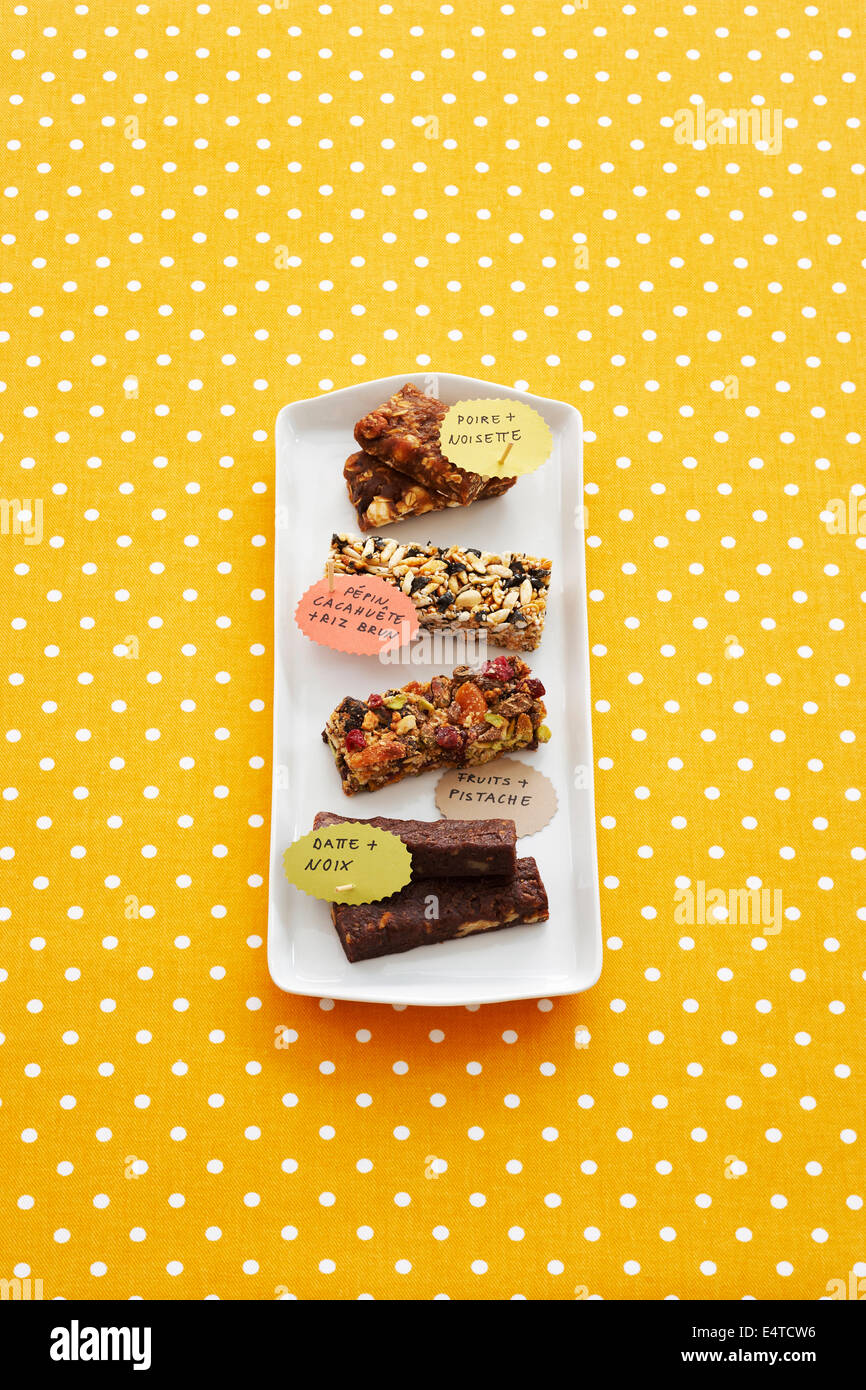Energy Bars on Tray with French Labels on Polka-dot Background Stock Photo