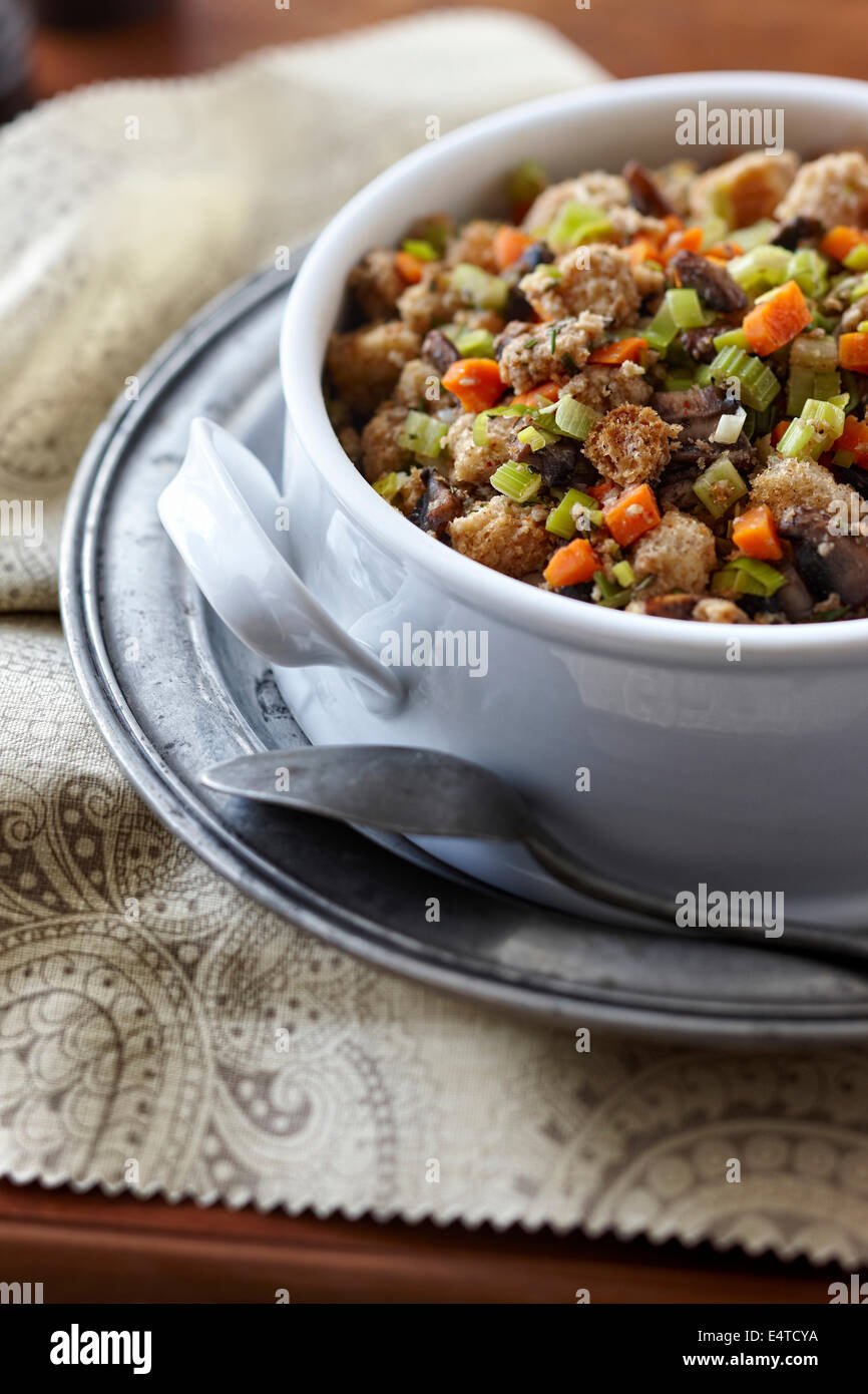 Large bowl of holiday turkey stuffing, whole wheat bread, carrots