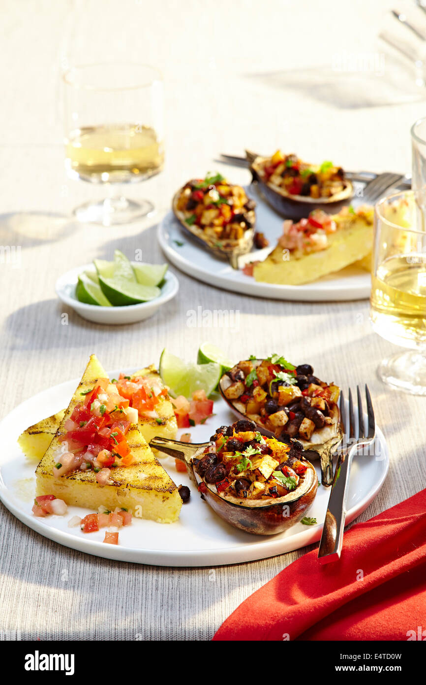 Vegan Meal with Stuffed Eggplant and White Wine Stock Photo Alamy