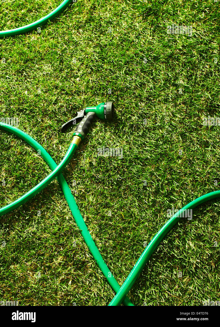 Garden Hose on Grass Stock Photo Alamy