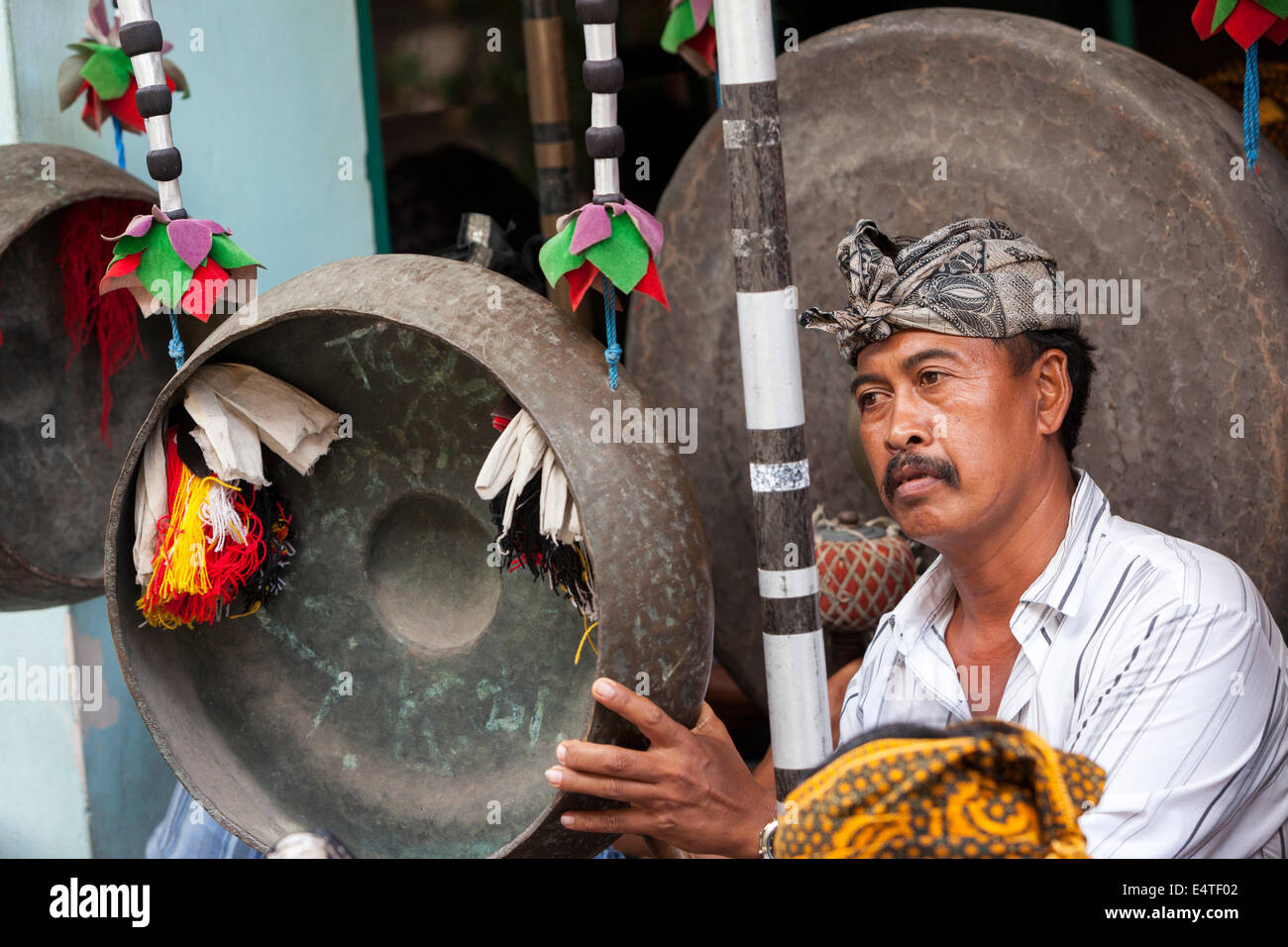 Bali, Indonesia. Balinese Hindu Playing a Gong in a Village Gamelan